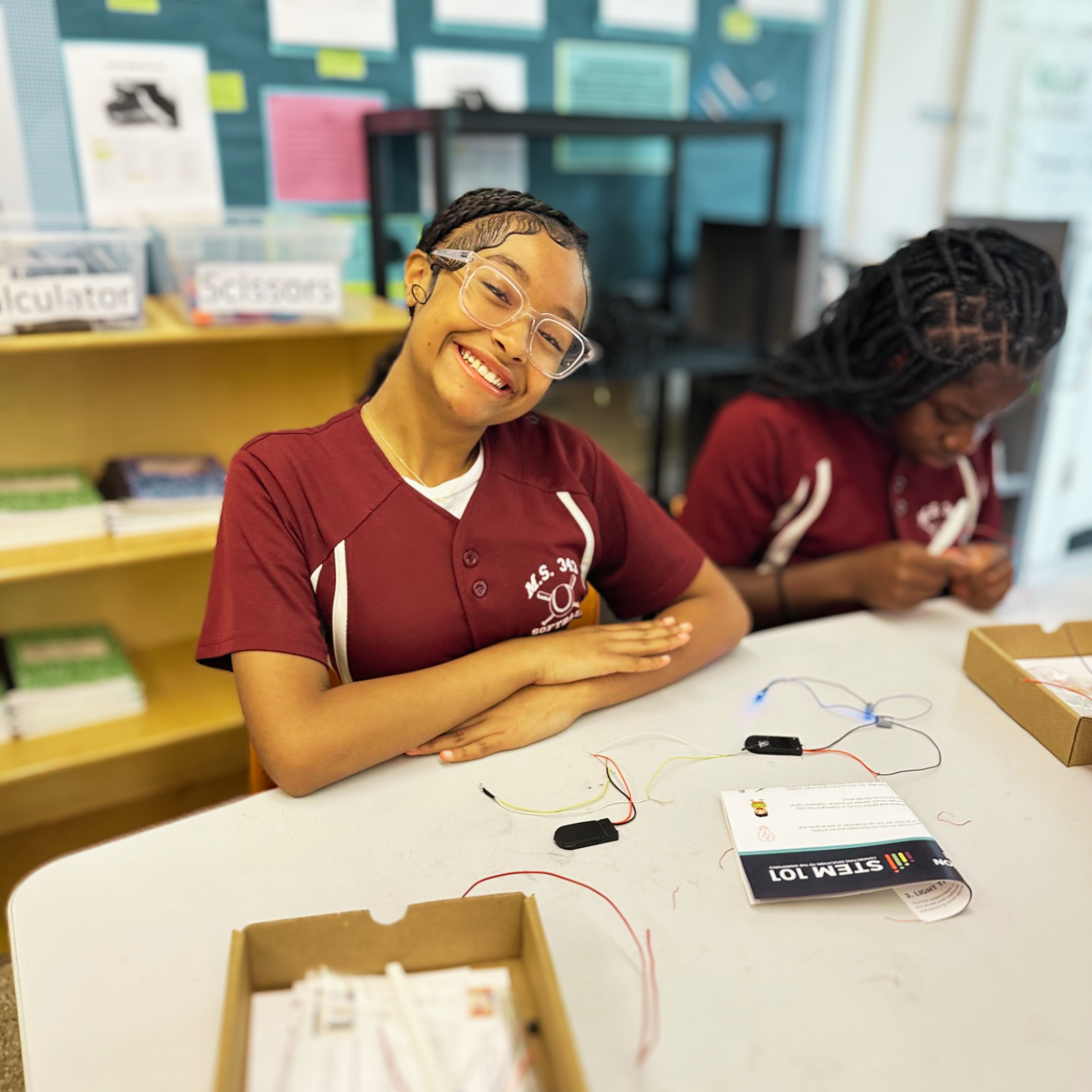 Middle school students engaging with Compass STEM curriculum activities that connect science and technology to real-world applications.